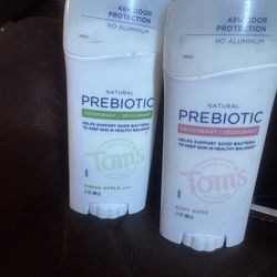 Natural prebiotic deodorant for daily odor protection. Aluminum-free formula supports skin's good bacteria. Two scent variants shown: Fresh Apple and 