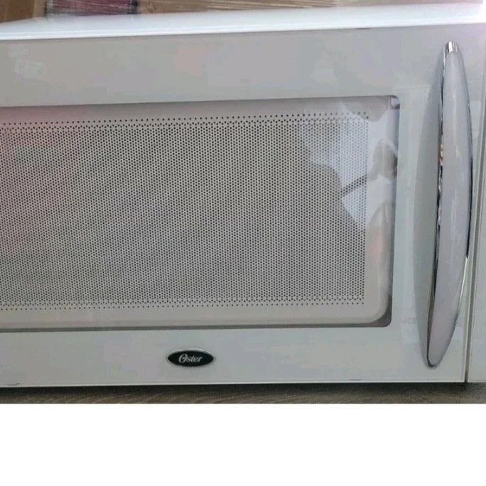 $80 ❤️💥 Oster OGB81101 1.1 cu. ft. Microwave Oven - White whs J7 Brown box