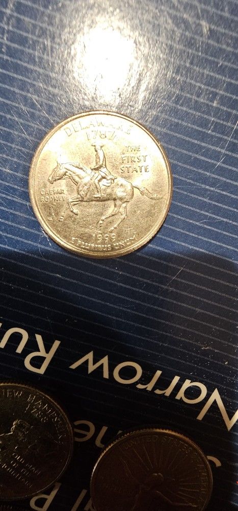 1999 delaware quarter with horses spit on it