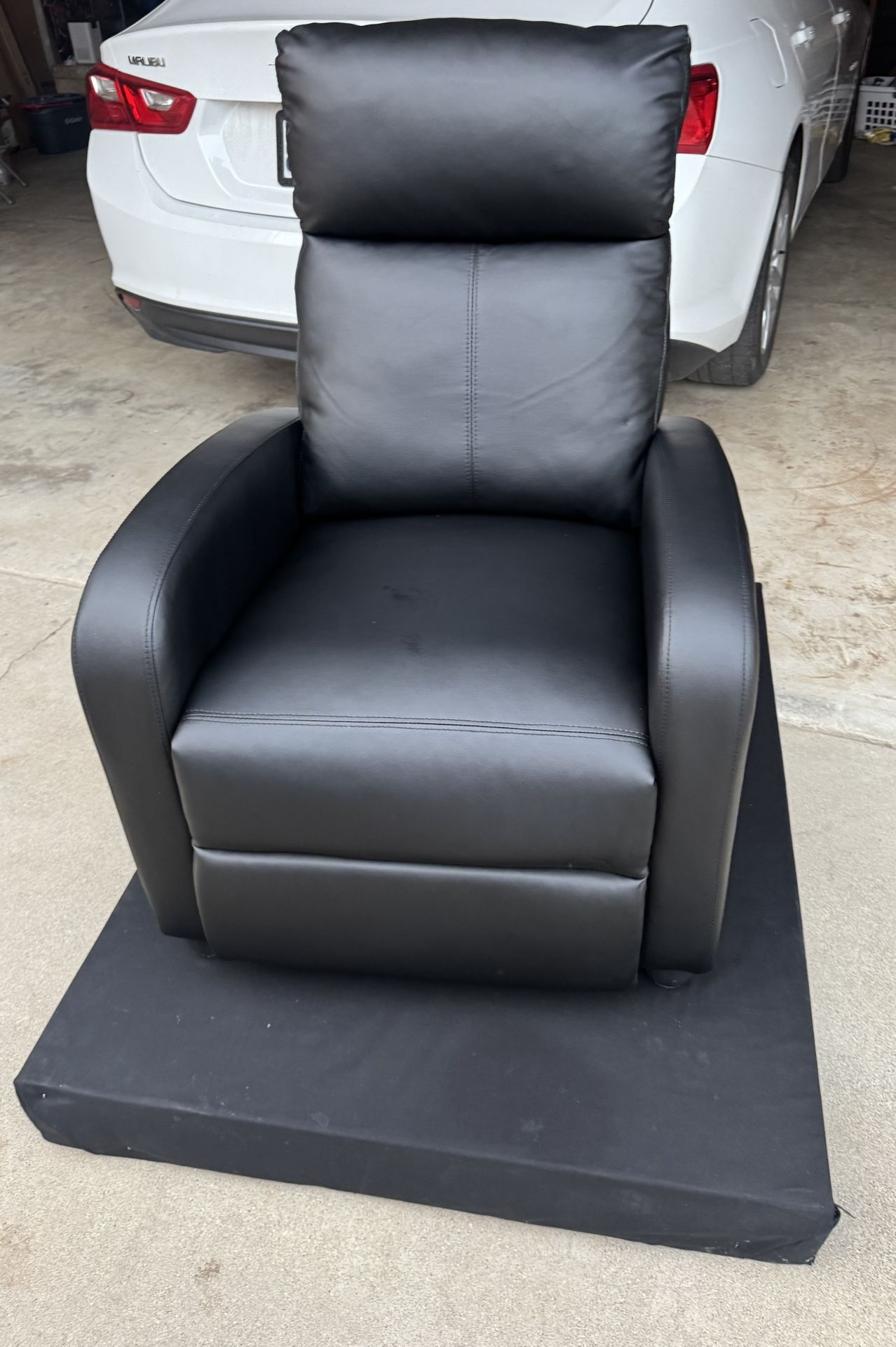 Black recliner with black Platform 