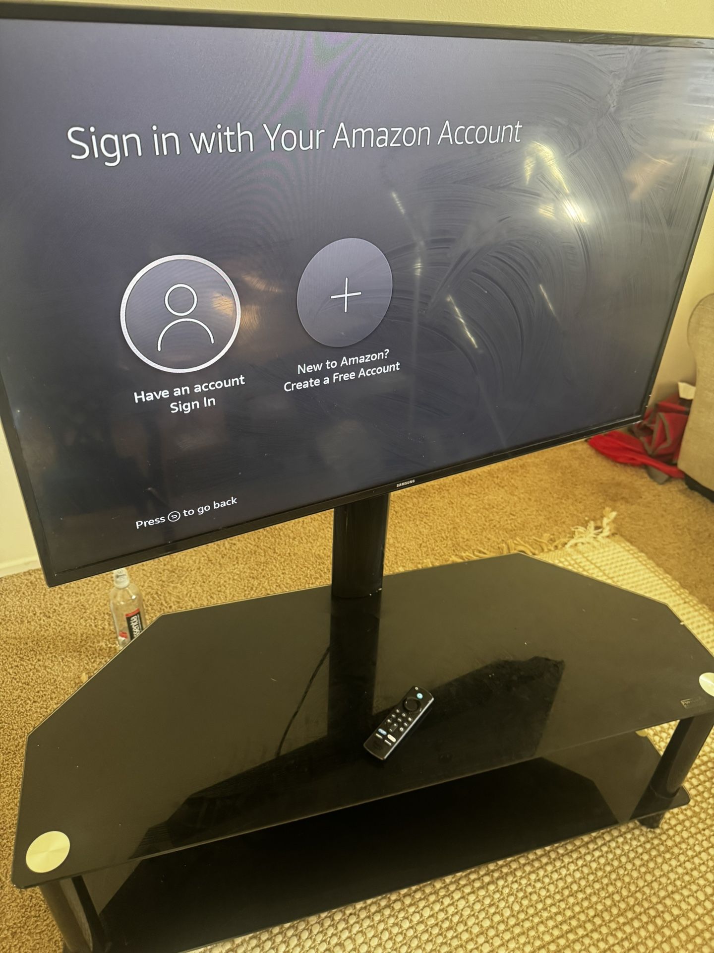 43 Inch Samsung Tv With A Fire Stick And And Black Stand Mount 