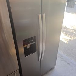 Nice, clean perfect working stainless steel side-by-side refrigerator will deliver