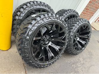 NEW 22x12 gloss black fittipaldi wheels wrapped in 33x12.50r22 atturo MT tires.