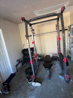 Marcy power cage with dumbbells, plates and attachments