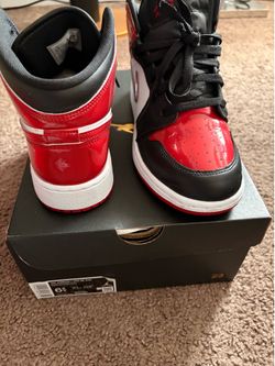 Red and black Jordan 1s