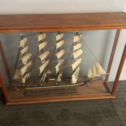 A old ship for sale in a glass container