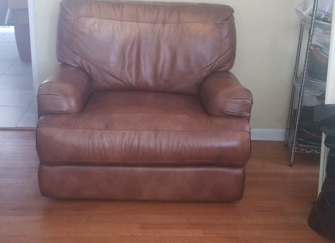 Brown leather power reclining oversized chair and matching couch