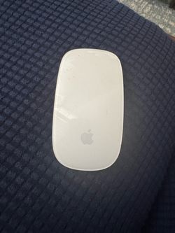White Apple Magic Mouse in good condition.