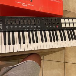 Electronic Piano With Beat Pads 