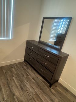 Bed frame with dresser and mirror