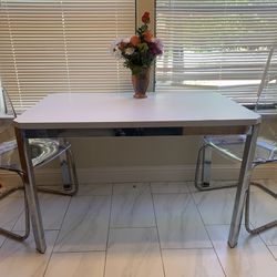 White and chrome dining table with 2 acrylic chrome chairs