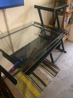 Glass desk with black metal frame