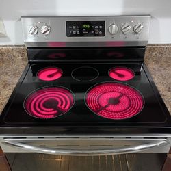 FRIGIDAIRE, STAINLESS  STEEL ELECTRIC STOVE. 5 Burners Glass Top 