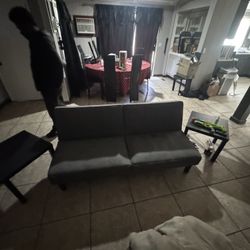 futon, coffee table and end tables