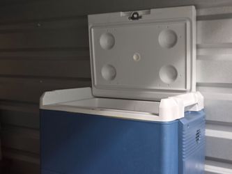 Electric refrigerator ice chest.