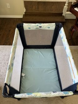 Graco Pack n Play with sheets and pad cover