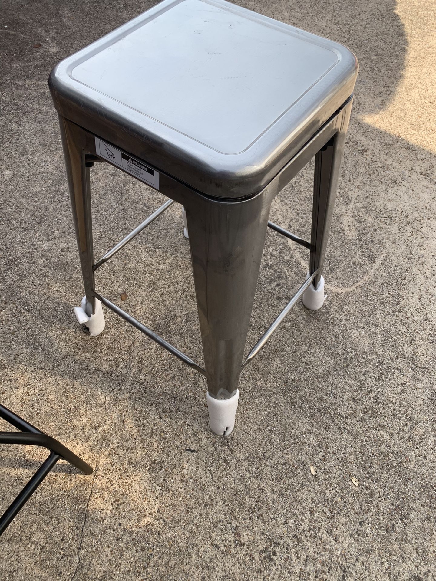 Solid metallic, swiveling bar stool ( brand new)