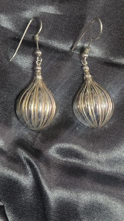 Vintage sterling silver puffed teardrop dangles with a distinct ribbed or "melon" texture.