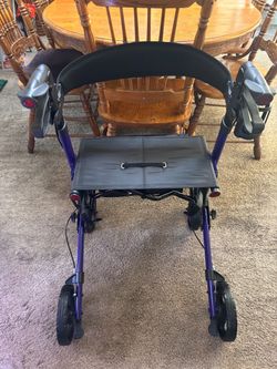 Walk behind or sit down chair with wheels