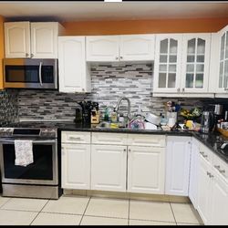 KITCHEN CABINETS USED WITH COUNTERTOPS AND SINK