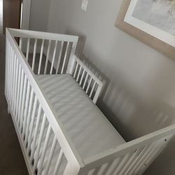 Solid wood crib with Sealy waterproof mattress