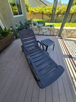 FREE - Plastic patio lounger and small side table.