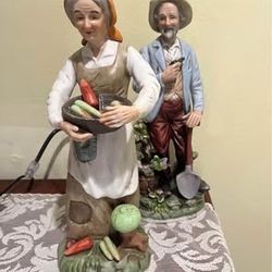 Adorable porcelain farm couple