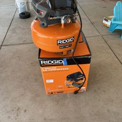 RIDGID 6 Gal. 150 PSI Portable Electric Oil-Free Jobsite Pancake Air Compressor with Dual Pressure Gauges and 2-Quick Couplers