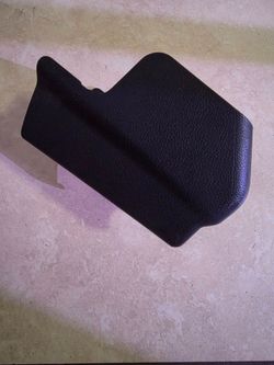 rear outer foot cover for the front left (driver's side) seat rail