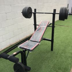 Gym Equipmentt bench press with 100lb weight set Combo With leg extension