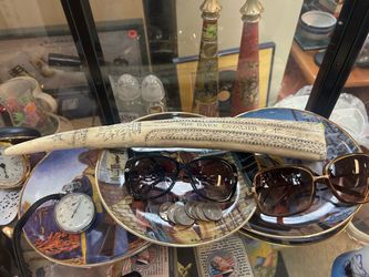 Cast resin replica scrimshaw tusk featuring the engraved title "The Bark Cavalier of New Bedford"