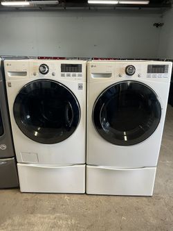 Set LG Washer And Electric Dryer With Pedestals