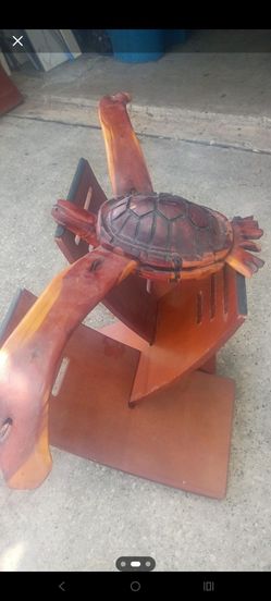 handcrafted wooden sea turtle made out of cedar or mahogany
