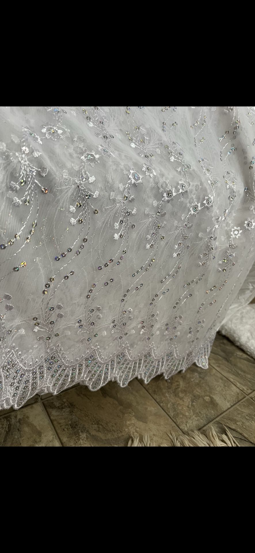 Embroidered and beaded chiffon fabric for making a wedding dress or curtains.