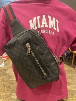 Gucci GG Supreme sling bag in black— $350 Italian craftsmanship, canvas with leather trim, belt or crossbody style.