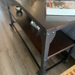 Avery Industrial Wood and Metal Console Table with Wheels, Black/Brown Finish