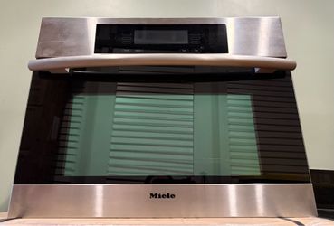 23.5”W x 17.75”H x 21.5”D Miele microwave / convection oven
