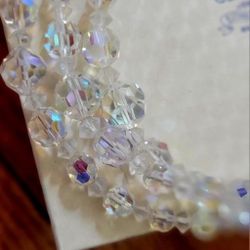 Pink topaz ring and one glass Beaded necklace.