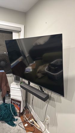 TCL smart Flatscreen tv around 53”, sound bar, and wall mount used