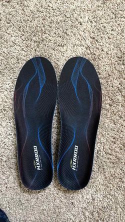 black athletic shoe insoles with blue wave patterns and white "HXRROD" branding.