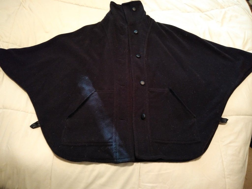 Nice polyester poncho, size small