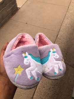 Small child’s unicorn slippers