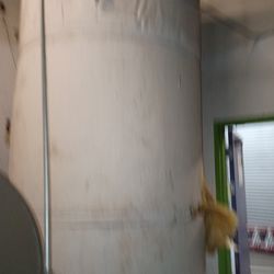 1,500-2,000 gallon stainless water storage tank.