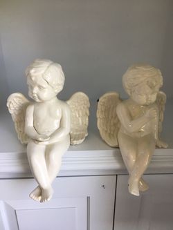 2 sitting cherub angels