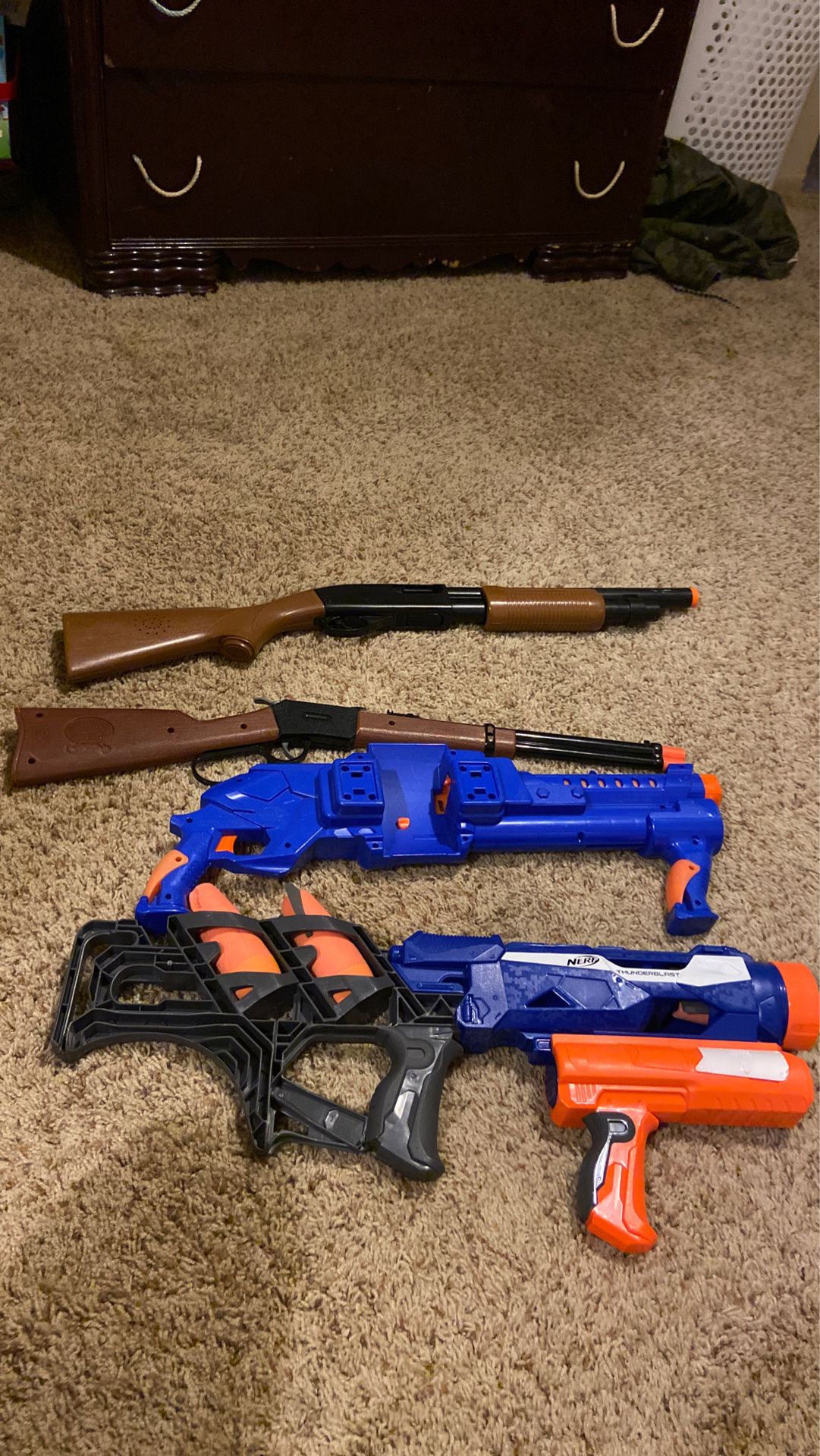 Two nerf guns and two toy guns