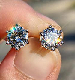 2 Carat Moissanite Round 18kt White Gold Plated Sterling Silver Stud Earrings.