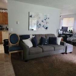 Couch With Nice Pillows And Foot Rest 