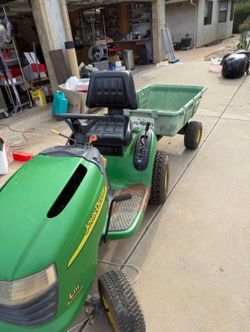 Up for sale Litle jhondere tractor and trailer runs real good