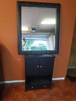 Mirror and cabinet