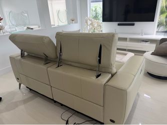 Brand new. BEIGE FULL LEATHER RECLINER SOFA